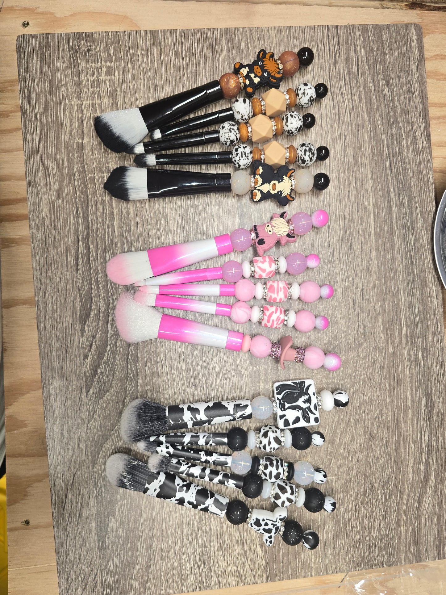 Silicone beaded makeup brushes, cowprint makeup brushes, pink makeup brushes, black makeup brushes, focal bead makeup brushes