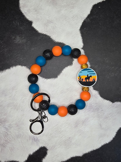 Riding off in the Sunset Wristlet