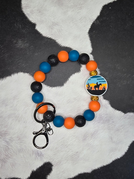 Riding off in the Sunset Wristlet